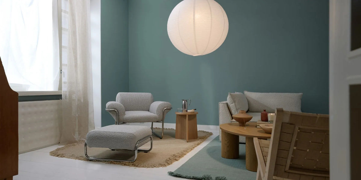 Blue-green living room painted with Tikkurila, showing interior colour inspiration