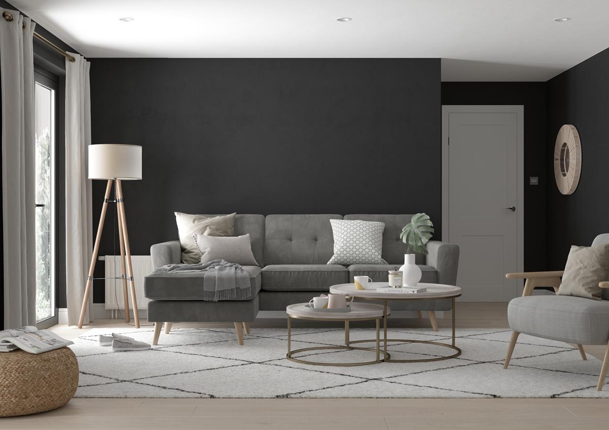 Modern living room with gray sofa, coffee table, and decorative items.